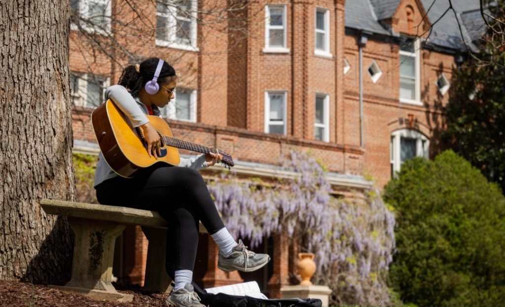 Student playing guitar